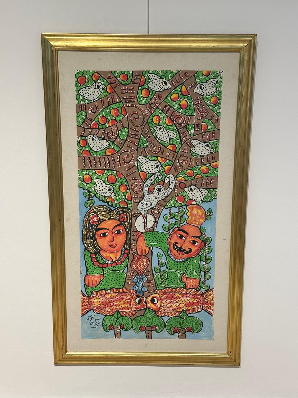 Man and lady under the tree